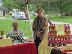 Len and Mother-In-law, Gloria, in the  Wolgast Tree Farm & Apiary booth at Duke Farms Farm To Table Market in Hillsborough.
